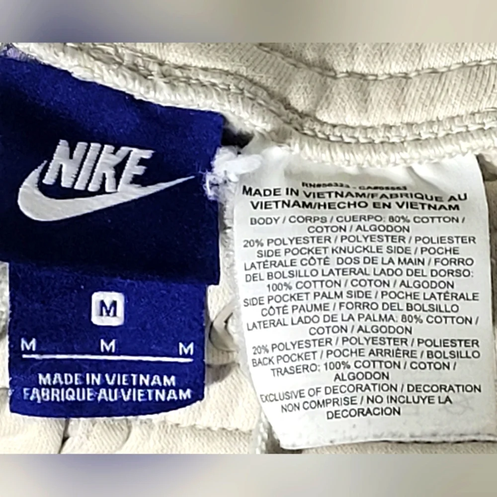 Nike beige with black big logo,pre-loved men shorts.Size : Medium